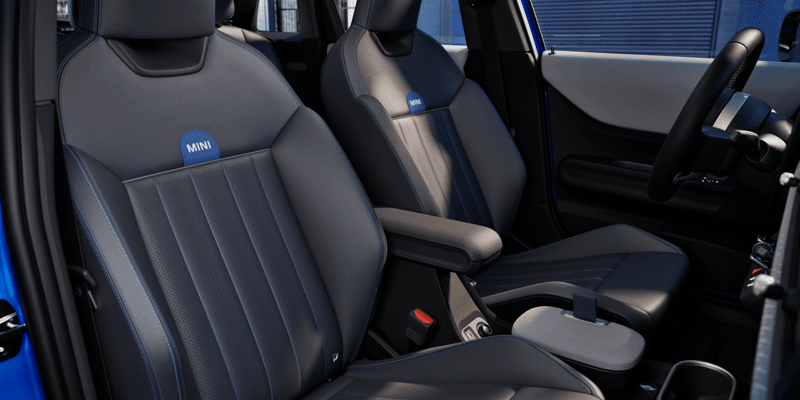 Modern MINI 4 door interior featuring two leather front seats featured at Jacksonville, FL