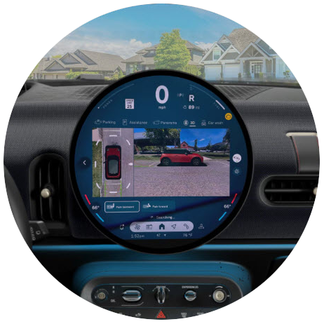 Front-view of the MINI OLED Display with Parking Assistant Plus being used.