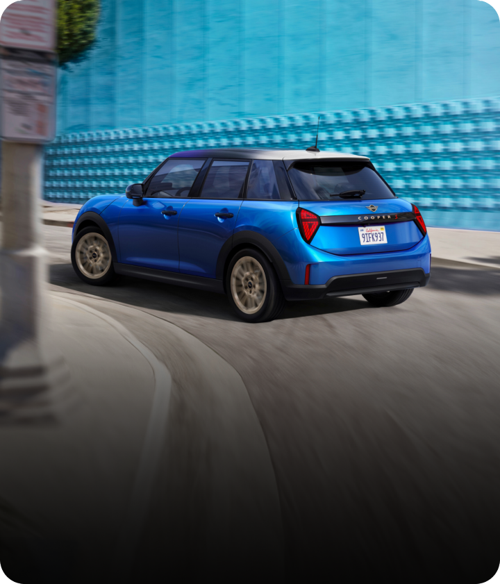 Cooper S 4 Door turns around a corner.