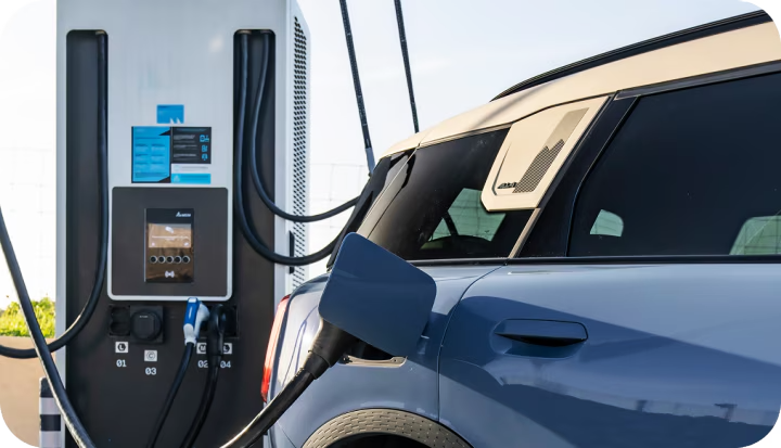 A MINI Countryman SE ALL4 charging at a charging station.