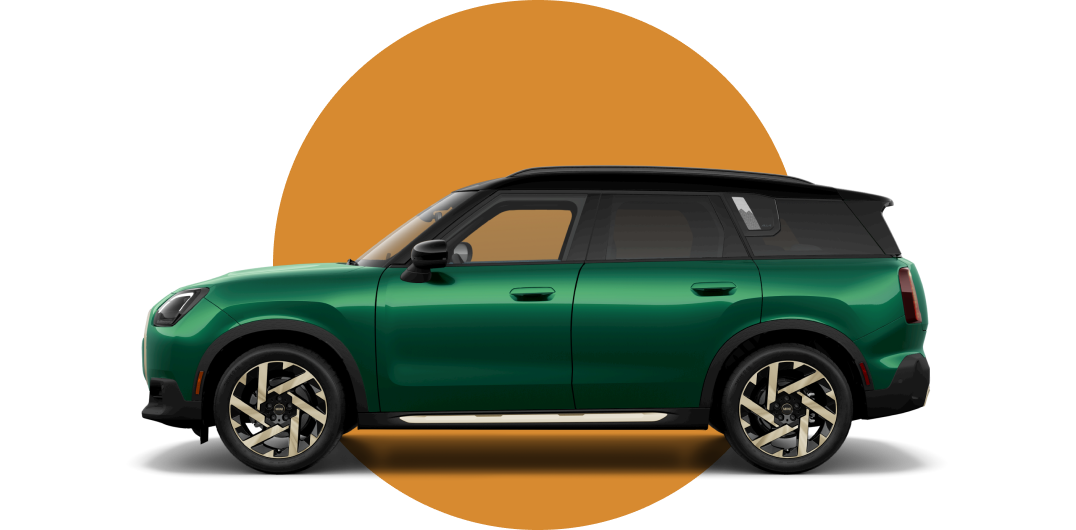 Side view of a 2025 MINI Countryman SE ALL4 in the British Racing Green IV body color, facing left with its shadow underneath it