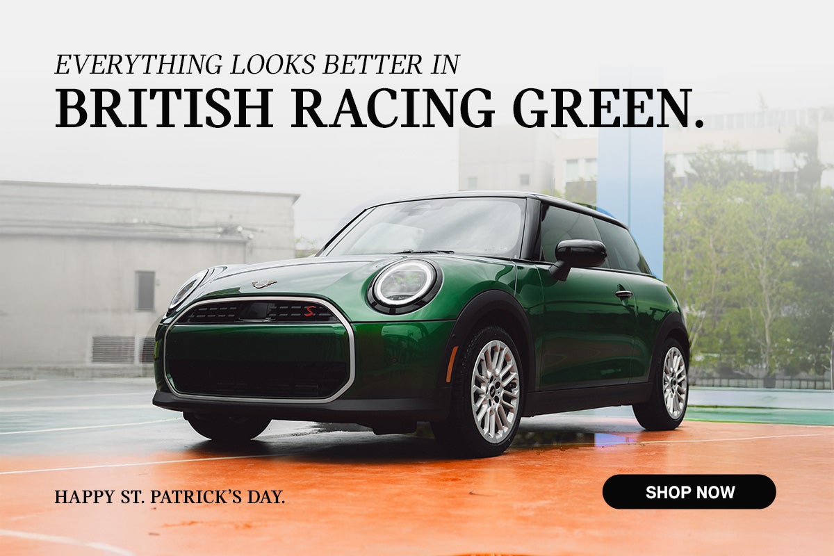 Green 2 door parked.